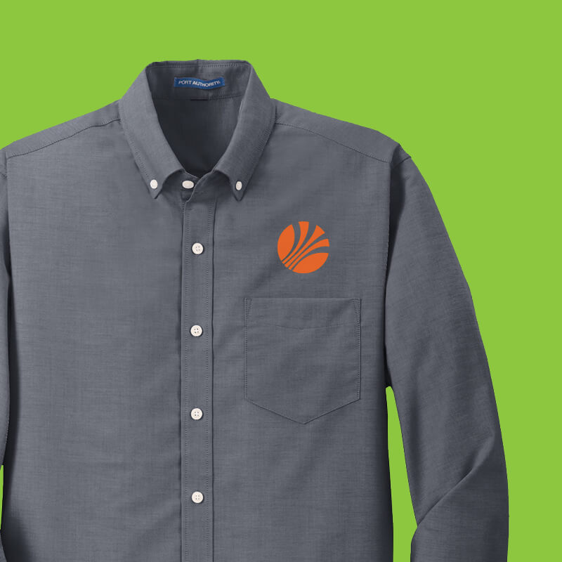 Dark grey button-down shirt embroidered with an orange logo